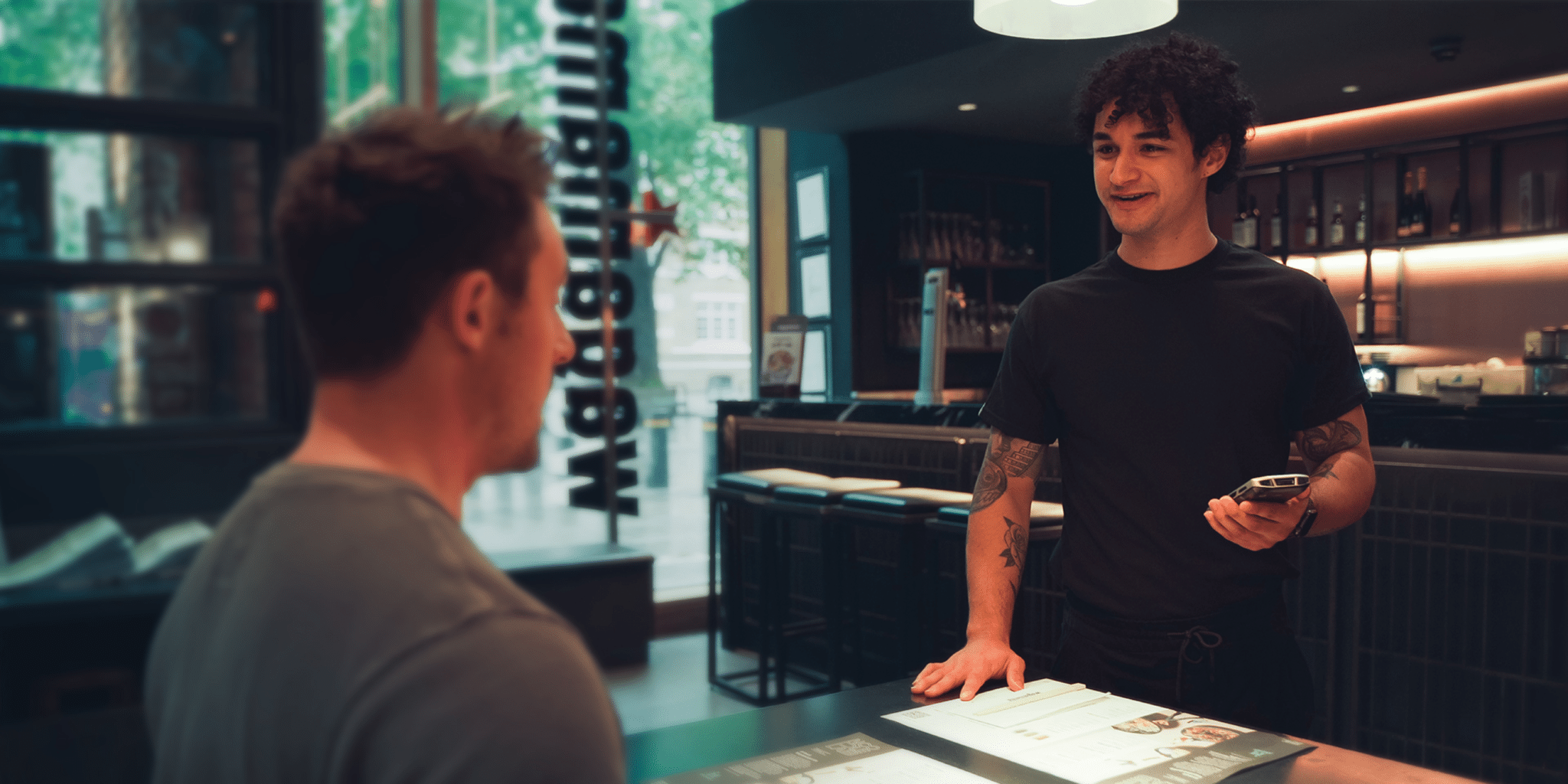 Hospitality and leisure employee talking to a customer