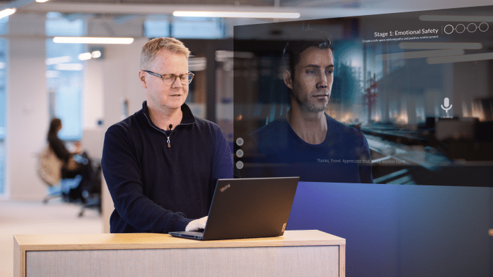Person demonstrating how to talk with a REALTALK AI avatar